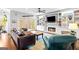 Relaxing living room with hardwood floors, a fireplace, built-in shelves, and sliding doors to an outdoor deck at 220 Terrane Rdg, Peachtree City, GA 30269