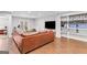 Spacious living room with a large leather sofa and built-in shelving at 220 Terrane Rdg, Peachtree City, GA 30269