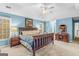 Spacious main bedroom featuring a large bed, decorative painting, and natural light from two large windows at 220 Terrane Rdg, Peachtree City, GA 30269