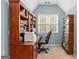 Bright office featuring custom built-in bookshelves and a comfortable desk area with lots of natural light at 220 Terrane Rdg, Peachtree City, GA 30269