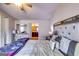 Bedroom featuring a large bed, a mirrored dresser, and an open doorway to the bathroom at 2325 Thackery Rd, Snellville, GA 30078