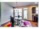 Cozy dining area with a stylish glass table and decorative chandelier lighting the space at 2325 Thackery Rd, Snellville, GA 30078