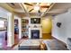 Inviting living room with a fireplace and coffered ceiling; seamless flow to the kitchen at 2325 Thackery Rd, Snellville, GA 30078