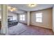 Spacious main bedroom with vaulted ceilings, large windows, and neutral colors and decorative pillars at 2325 Thackery Rd, Snellville, GA 30078