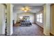 Bright main bedroom with a vaulted ceiling, decorative pillars and a large bed facing the window at 2325 Thackery Rd, Snellville, GA 30078