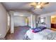 Spacious bedroom featuring two columns, carpet flooring, a dresser and an attached bathroom at 2325 Thackery Rd, Snellville, GA 30078