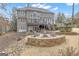 Stunning backyard view featuring a firepit, multilevel deck, and well-manicured lawn, creating an inviting outdoor space at 804 Carnellian Ln, Peachtree City, GA 30269