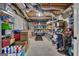 Unfinished basement with shelving, storage, exposed beams, and golf equipment at 804 Carnellian Ln, Peachtree City, GA 30269