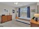 Bedroom featuring a boat-shaped bed, complemented by natural light streaming through the window at 804 Carnellian Ln, Peachtree City, GA 30269