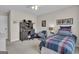 Bedroom featuring a desk, workspace, and a window bringing in natural light at 804 Carnellian Ln, Peachtree City, GA 30269