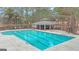 Large community pool with a covered gazebo area and lounge seating at 804 Carnellian Ln, Peachtree City, GA 30269