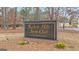 Kedron Hills Swim Club sign with brick base and landscaped surroundings at 804 Carnellian Ln, Peachtree City, GA 30269