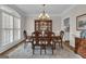 Elegant dining room with hardwood floors, traditional chandelier, and china cabinet with hutch at 804 Carnellian Ln, Peachtree City, GA 30269