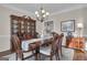 Elegant dining room with hardwood floors and a spacious design, perfect for entertaining guests at 804 Carnellian Ln, Peachtree City, GA 30269