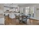 An open concept eat in kitchen with island and white cabinetry at 804 Carnellian Ln, Peachtree City, GA 30269