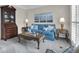 Cozy living room with neutral carpet, blue sofa, and traditional furnishings. Plenty of natural light at 804 Carnellian Ln, Peachtree City, GA 30269