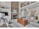 A bright living room with a stone fireplace and a view of the upper level at 804 Carnellian Ln, Peachtree City, GA 30269