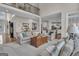 Open concept living room with view of wet bar and kitchen in background at 804 Carnellian Ln, Peachtree City, GA 30269