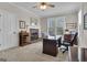 Comfortable office featuring a fireplace, and a spacious desk at 804 Carnellian Ln, Peachtree City, GA 30269