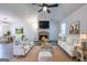 Cozy living room featuring a stone fireplace, vaulted ceilings, and modern decor at 141 Muirwood Dr, Temple, GA 30179