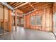 Unfinished basement provides a blank canvas with exposed framing, insulation, and natural light at 1320 Kay Se Ter, Conyers, GA 30013