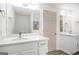 Bright bathroom featuring double vanities with quartz counters, mirrors, and sleek fixtures at 1320 Kay Se Ter, Conyers, GA 30013