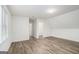 Bright room featuring stylish wood floors and access to an adjacent room with ample natural light for a welcoming ambiance at 1320 Kay Se Ter, Conyers, GA 30013