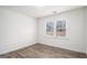 Bright bedroom with wood-look floors and a large window providing ample natural light at 1320 Kay Se Ter, Conyers, GA 30013