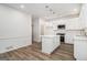 Bright kitchen featuring a center island with modern pendant lighting and stainless steel appliances at 1320 Kay Se Ter, Conyers, GA 30013