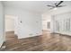 Open-concept living room with wood-look floors leading to the kitchen and back patio at 1320 Kay Se Ter, Conyers, GA 30013