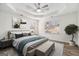Stylishly furnished main bedroom with tray ceilings, wood floors, and abundant light from large windows at 1320 Kay Se Ter, Conyers, GA 30013