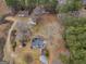 Aerial view of property showcases the home, surrounding trees, and large lot, highlighting its peaceful setting at 6393 Walker Rd, Riverdale, GA 30296