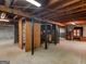 Unfinished basement with concrete floor, block wall and exposed ceiling ready for customization at 6393 Walker Rd, Riverdale, GA 30296