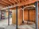 Unfinished basement with concrete floor, block wall and exposed ceiling ready for customization at 6393 Walker Rd, Riverdale, GA 30296