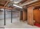 Unfinished basement with concrete floor, block wall and exposed ceiling ready for customization at 6393 Walker Rd, Riverdale, GA 30296