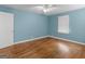 Bedroom featuring hardwood floors, a ceiling fan, and neutral paint at 6393 Walker Rd, Riverdale, GA 30296