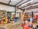 Spacious garage featuring shelving units, concrete floor, and ample storage at 6393 Walker Rd, Riverdale, GA 30296