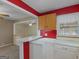 Kitchen features a breakfast bar that overlooks the living room and lots of natural light at 6393 Walker Rd, Riverdale, GA 30296