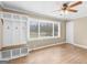 Bright living room with hardwood floors, natural light, and custom-built storage at 6393 Walker Rd, Riverdale, GA 30296