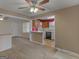 Open living room view to the kitchen with a breakfast bar and plenty of natural light at 6393 Walker Rd, Riverdale, GA 30296