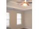 Carpeted main bedroom with neutral walls and ceiling fan at 7564 Mountain Ridge Ln, Lithonia, GA 30058