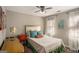 Cozy bedroom features a ceiling fan, natural light, and calming neutral paint colors at 302 Cumberland Ct, Peachtree City, GA 30269
