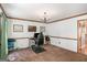 Spacious office featuring a desk, neutral walls, and a view of the backyard through a window at 302 Cumberland Ct, Peachtree City, GA 30269