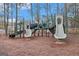 Community playground featuring multiple slides and climbing structures for enjoyment at 302 Cumberland Ct, Peachtree City, GA 30269