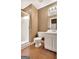 Bathroom featuring walk-in shower, toilet, and vanity with mirror, offering a practical design at 498 N Jeff Davis Dr, Fayetteville, GA 30214