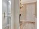 Charming powder room with pedestal sink and decorative mirror, adjacent to a hallway at 498 N Jeff Davis Dr, Fayetteville, GA 30214