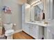 Bathroom with white cabinetry, stylish fixtures, and a coordinated color scheme for a fresh look at 498 N Jeff Davis Dr, Fayetteville, GA 30214