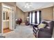 Spacious room featuring a vaulted ceiling, a recliner, and a view into the ensuite bathroom at 498 N Jeff Davis Dr, Fayetteville, GA 30214