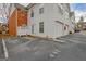 Exterior showcasing townhome units with dedicated parking spaces in a well-maintained community setting at 498 N Jeff Davis Dr, Fayetteville, GA 30214