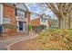 Charming brick townhome featuring a manicured front yard and walkway, inviting curb appeal at 498 N Jeff Davis Dr, Fayetteville, GA 30214
